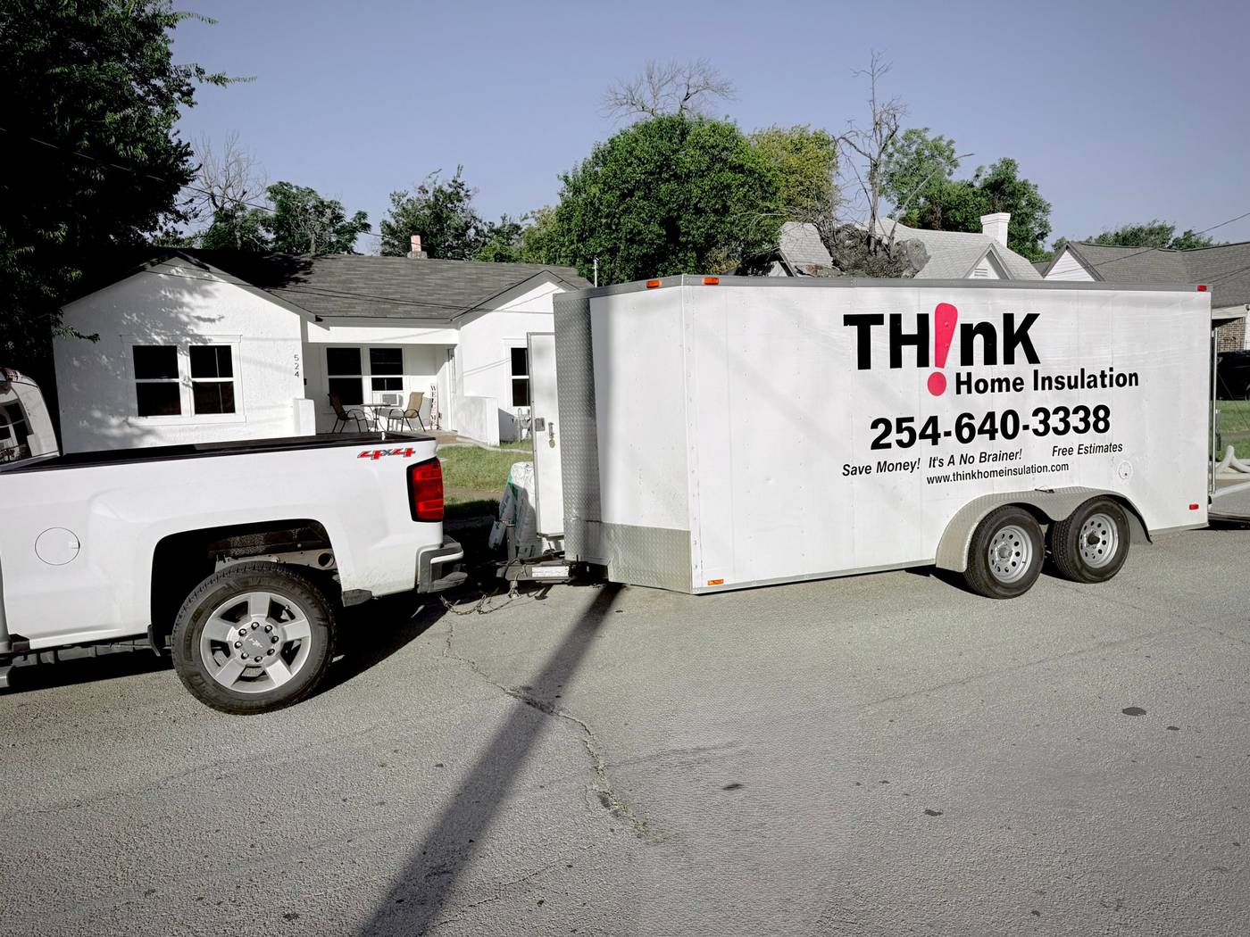 Think Home Pros truck and trailer at a job in Central Texas, with the TH!nK Home Insulation logo and phone number (254) 640-3338